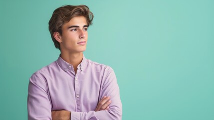 Obraz premium A man in a lavender shirt on a background of mint green