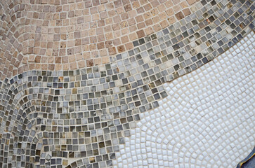 Beautiful pattern of  decorating small glazed tiles on the wall