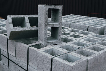 Hollow concrete wall blocks assembled on pallets. Construction concrete block. Vibration-pressed...