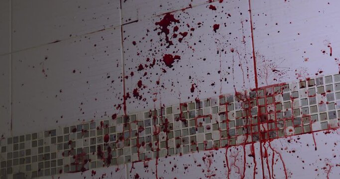 Blood splattered on the white tiled wall, Slow motion
