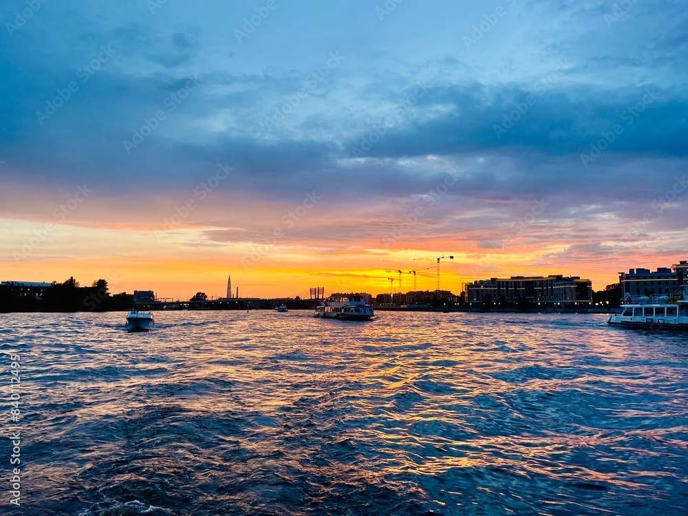 Wall mural Fantastic sunset at the city river 