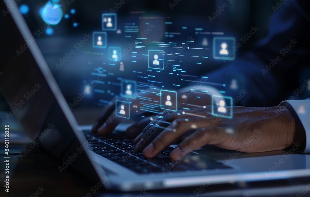 Poster hands engage with a virtual interface laptop displaying data management icons, representing modern d
