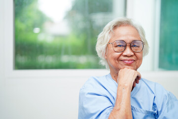 Asian senior woman wearing eyeglasses or vision glasses at home care service.