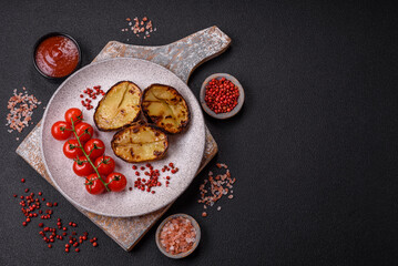 Delicious potato halves in skins baked on the grill