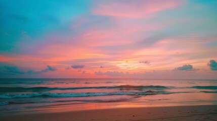 Obraz premium Tropical Sunset Bliss: Vibrant Beach View. The vibrant colors of a tropical sunset with waves gently kissing the sandy beach.