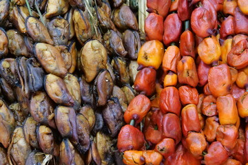 Deshelled mussels and other shellfish close up view.