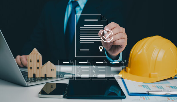 Architect or engineer Checking the list of documents and approving the project, Approved Buildings Permit concept with approved residential building project, Construction project inspection.