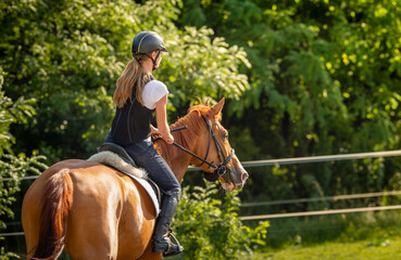  woman riding a horse