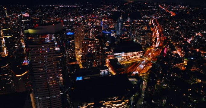 Scenic view of modern Seattle, Washington, US at night. Jaw-dropping panorama of luminous metropolis from drone.