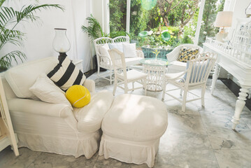 Cozy living room sofa couch home background with copy space. Warm home interior bright simple living space. Home showcase interior light bokeh furniture decor. Home furniture Blurry background