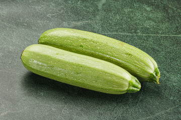 Raw green ripe zucchini vegetable