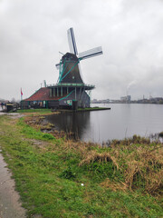 Naklejka premium The Zaanse Schans windmills in rainy day
