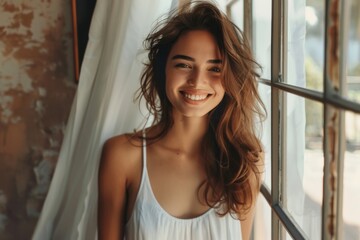Lady in white gown near window with drapery
