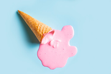 waffle cone with melted pink ice cream