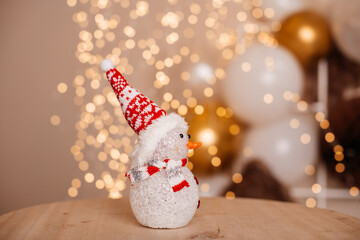 Little glowing snowman. Decoration for Christmas, New Year.