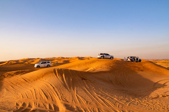 Ras Al Khaimah, United Arab Emirates - May 06, 2024: jeep safari in the desert at sunset