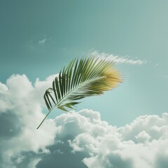 Single palm leaf floating in a bright blue sky with white clouds. The palm leaf appears to be windblown and is far from any other trees.