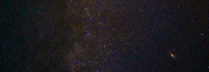Panorama of the starry sky at night with stars and the Milky Way with galaxies. Panorama, panoramic...