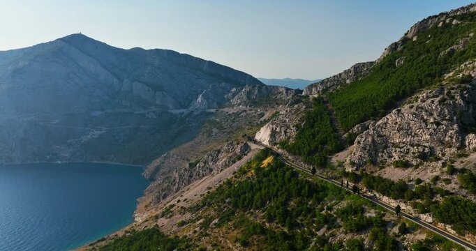 Drone flying along the mountainous coastline of the Makarska riviera in Croatia