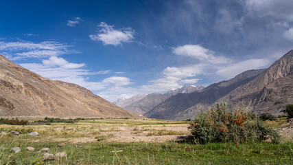 Scenic landscape view of Wakhan Corridor valley with Hindu Kush mountain range in Afghanistan near Ishkashim, Gorno-Badakhshan, Tajikistan Pamir