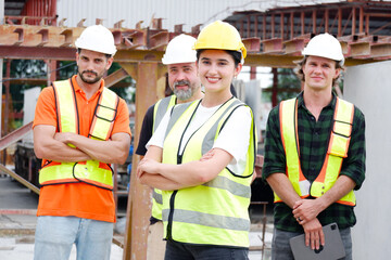 Engineer wearing safety helmet standing smiling on site