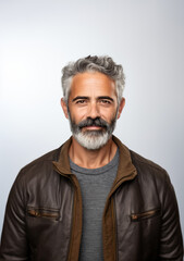 Fototapeta premium Casual middle-aged man with beard and in leather jacket portrait