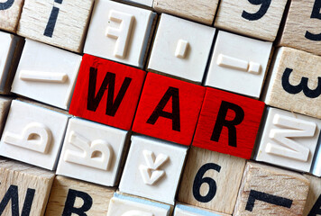 The word WAR arranged from wooden letters.