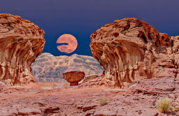 Moon rising above unique geological formation from Jurassic period, composite digitally generated image was made using tools as Adobe Photoshop from my own original photos - Powered by Adobe