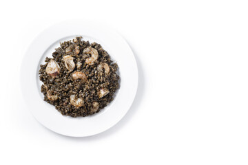 Black rice with seafood in plate isolated on white background. Top view. Copy space