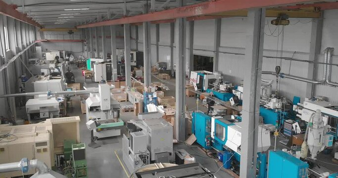 Shop with machines for production of plastic parts. Injection molding thermoplastic machine.