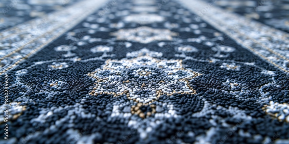 Poster a close-up image of a blue and white patterned rug with a focus on the intricate design