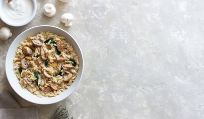 Orzo pasta with mushrooms and spinach. Italian Cuisine. Vegetarian food.