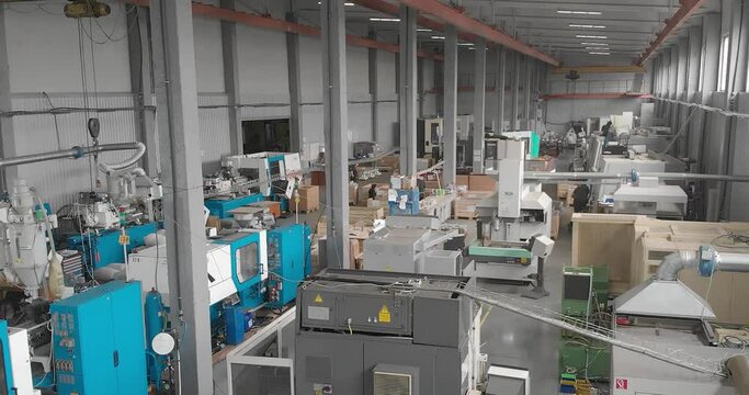 Shop with machines for production of plastic parts. Injection molding thermoplastic machine.