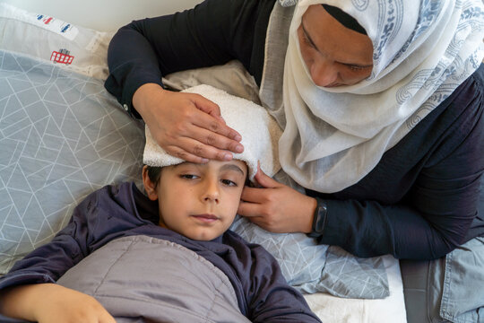 Mother caring for son during hypoglycemic episode