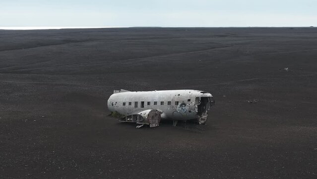 Aerial view of the Solheimasandur Plane Wreck in Iceland. Wrecked old plane Dakota on the black sand beach, south coast of Iceland
