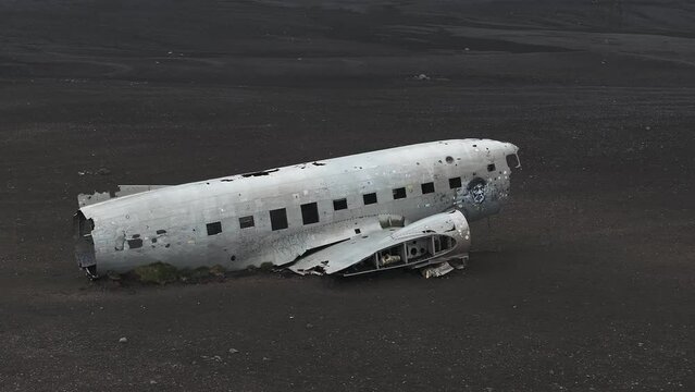 Aerial view of the Solheimasandur Plane Wreck in Iceland. Wrecked old plane Dakota on the black sand beach, south coast of Iceland