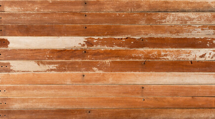 Naklejka premium Faded orange old wooden planks texture background