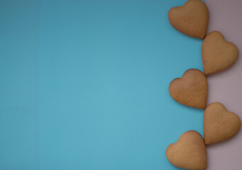 Background pink and blue with hearts baked goods for loved ones
