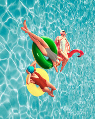 Three women in colorful swimsuits and caps lying on floating circles in pool and relaxing....