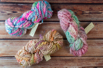beautiful handsoun wool yarn on wooden table 