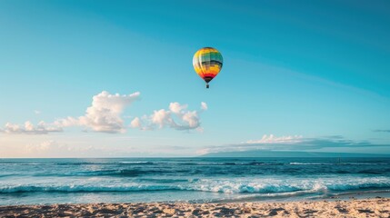 Fototapeta premium A Hot Air Balloon Soaring Above a Sandy Beach