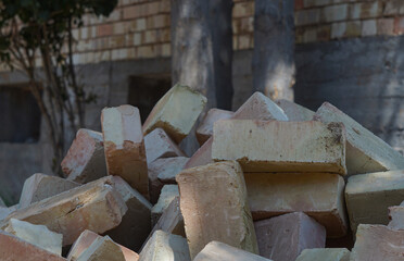 yellow brick piled up on the ground