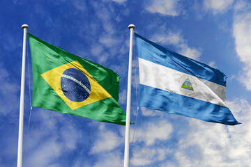 3D illustration. Brazil and Nicaragua flags waving in the sky. High detailed waving flag. 3D render. Flags fluttered in the cloudy sky, symbolizing diplomatic relations.