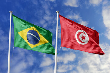 3D illustration. Brazil and Tunisia Flag waving in the sky. High detailed waving flag. 3D render....