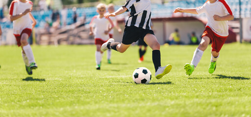 Kids as Football Soccer Players Running with Ball. Footballers Kicking Play League Match During...