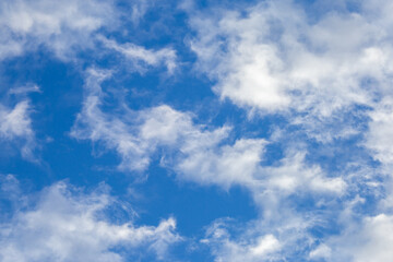Bright sky texture background with white clouds, pleasing to the eye.