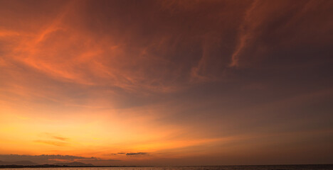 Sunset Sky clouds over Horizon sea landscape in the Evening Summer season background, Dramatic  Orange, Yellow sunlight fluffy after sundown on twilight, Dusk sky backgrounds  