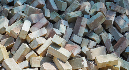 yellow brick piled up on the ground