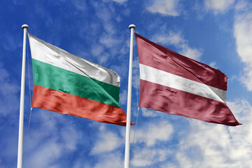3D illustration. Bulgaria and Latvia Flag waving in the sky. High detailed waving flag. 3D render. Waving in the sky. Flags fluttered in the cloudy sky.