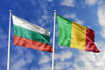 3D illustration. Bulgaria and Mali Flag waving in the sky. High detailed waving flag. 3D render. Waving in the sky. Flags fluttered in the cloudy sky.